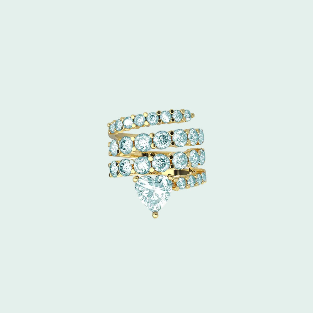 Set of three gold rings with gemstones on a white background