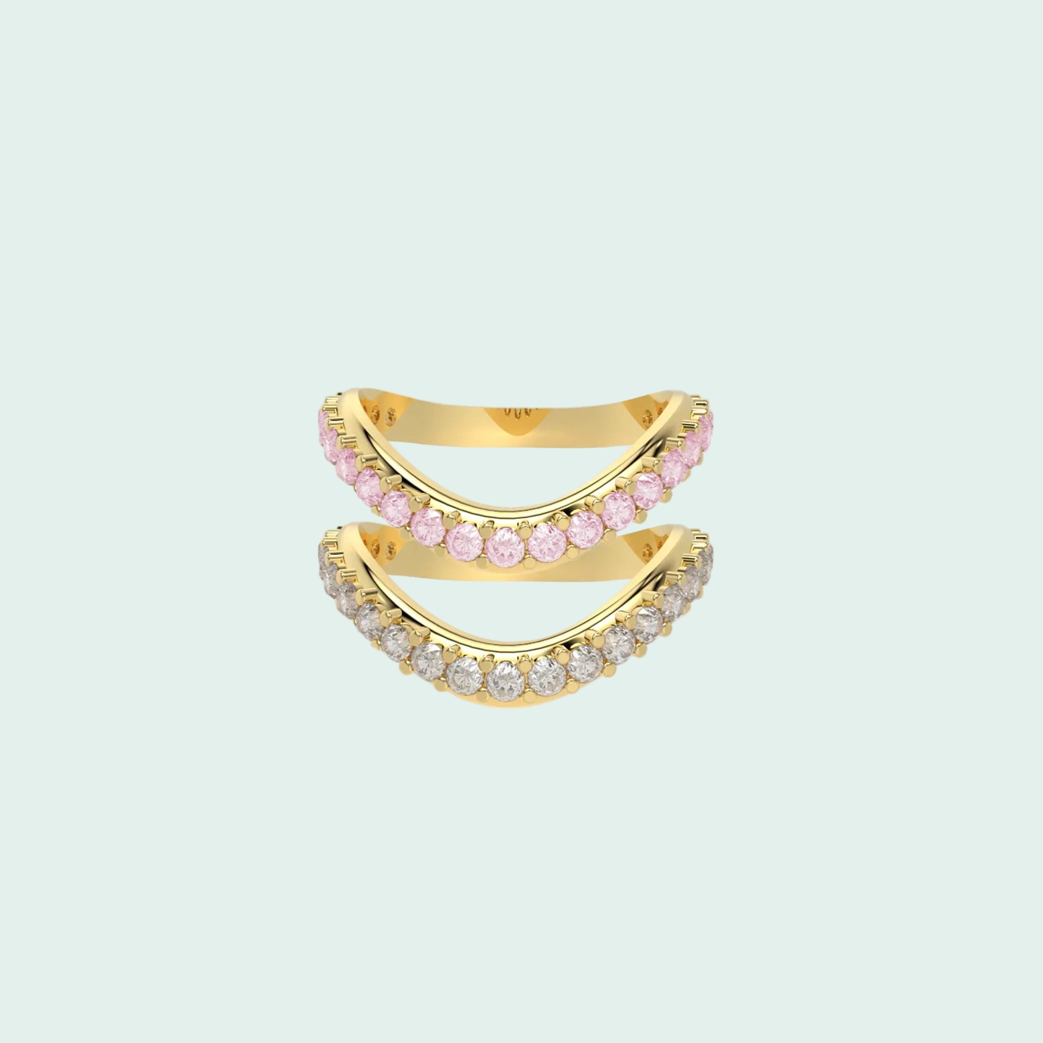 Gold and pink gemstone ring on a white background