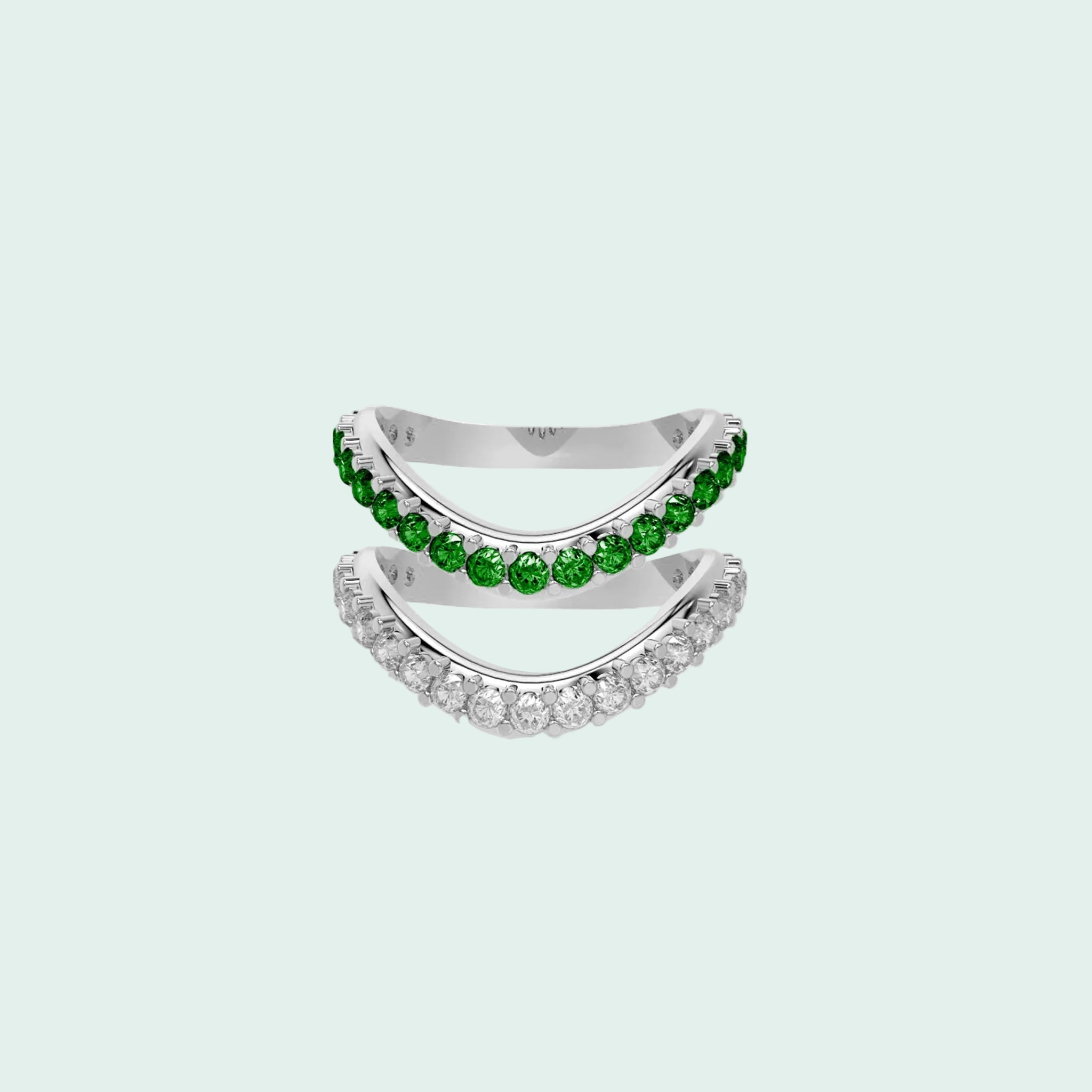 Two silver rings with green gemstones on a white background