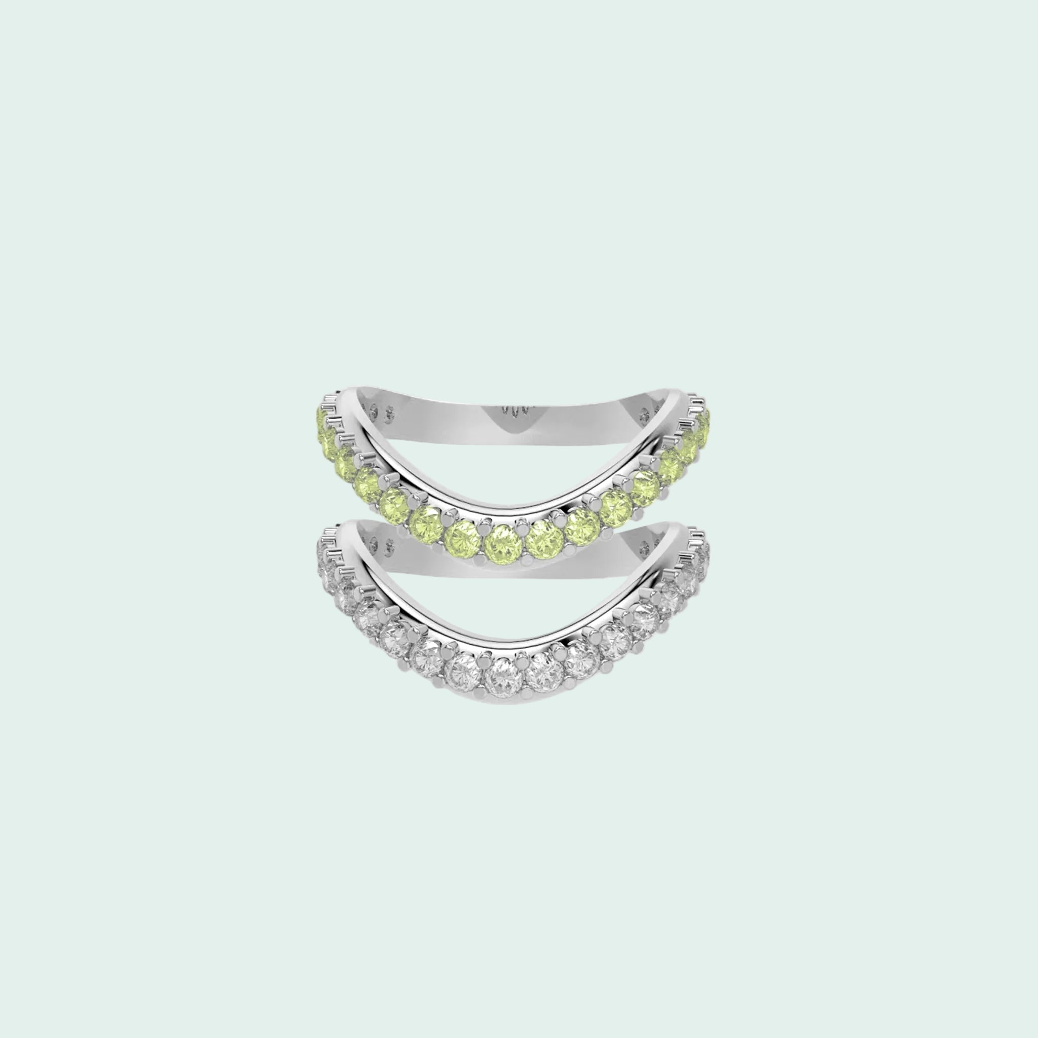 Two silver rings with green gemstones on a white background