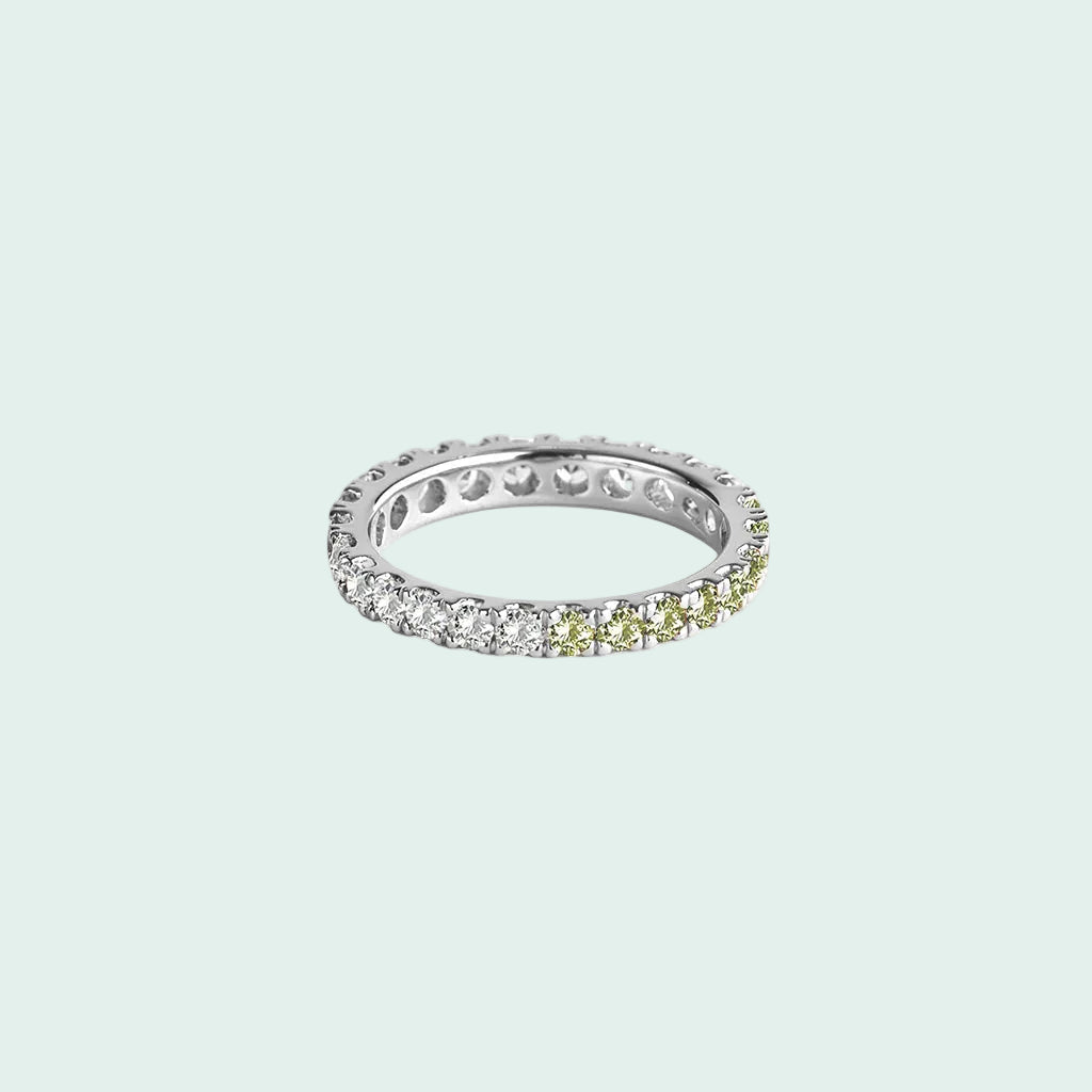 Silver ring with embedded diamonds on a white background