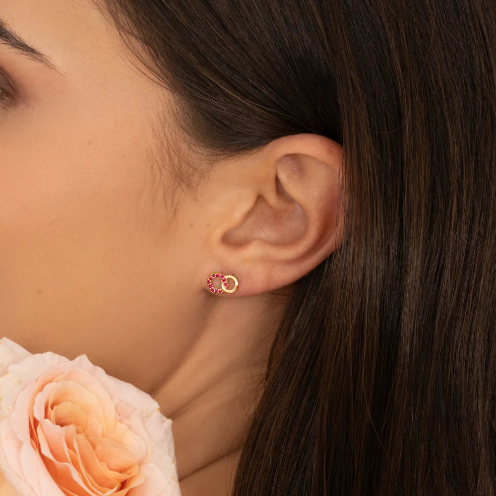 Apex Interlock Stud Earrings (Emerald Edition)