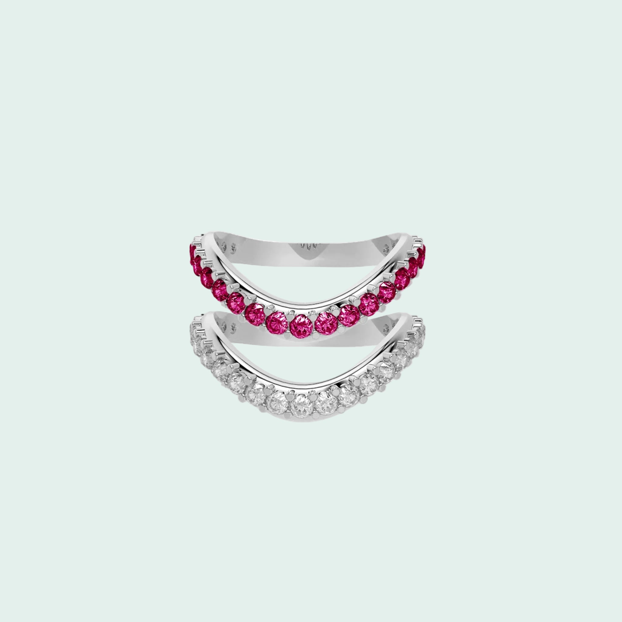 Two silver rings with pink gemstones on a white background
