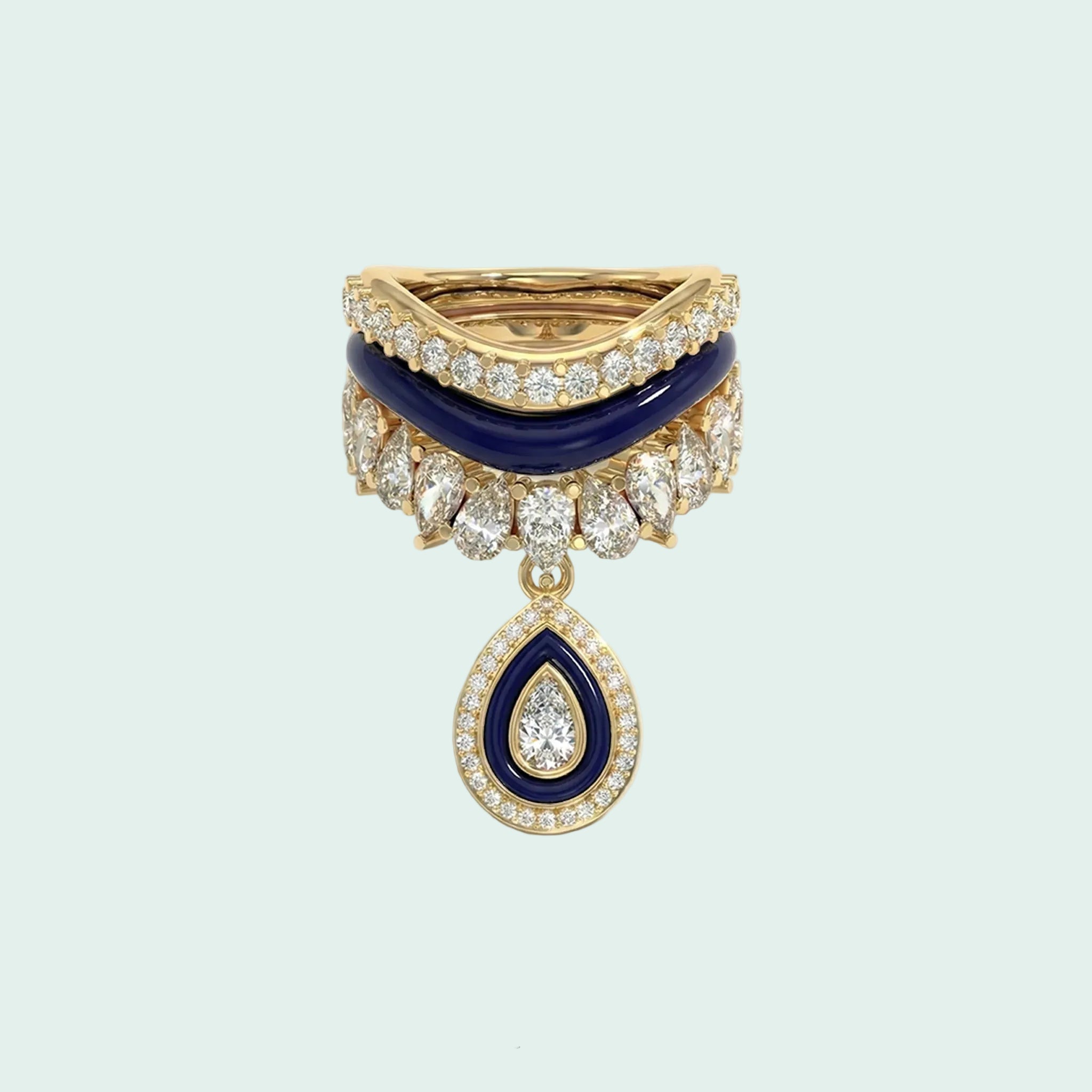 Stack of three gold and blue rings with diamond accents on a white background