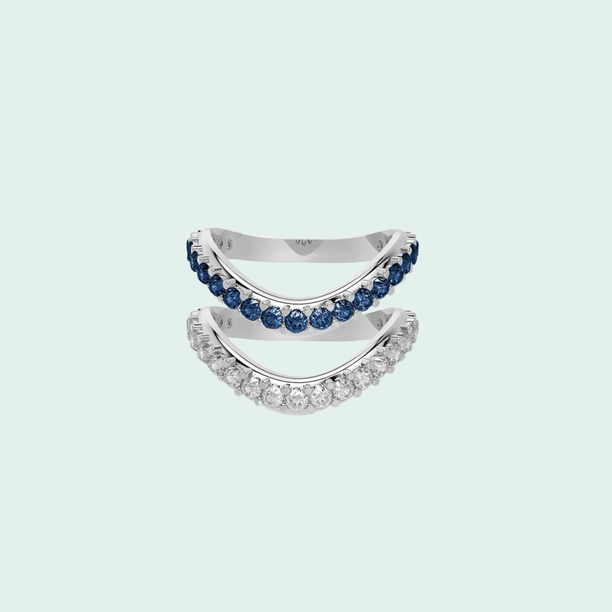 Silver ring with blue gemstones on a white background