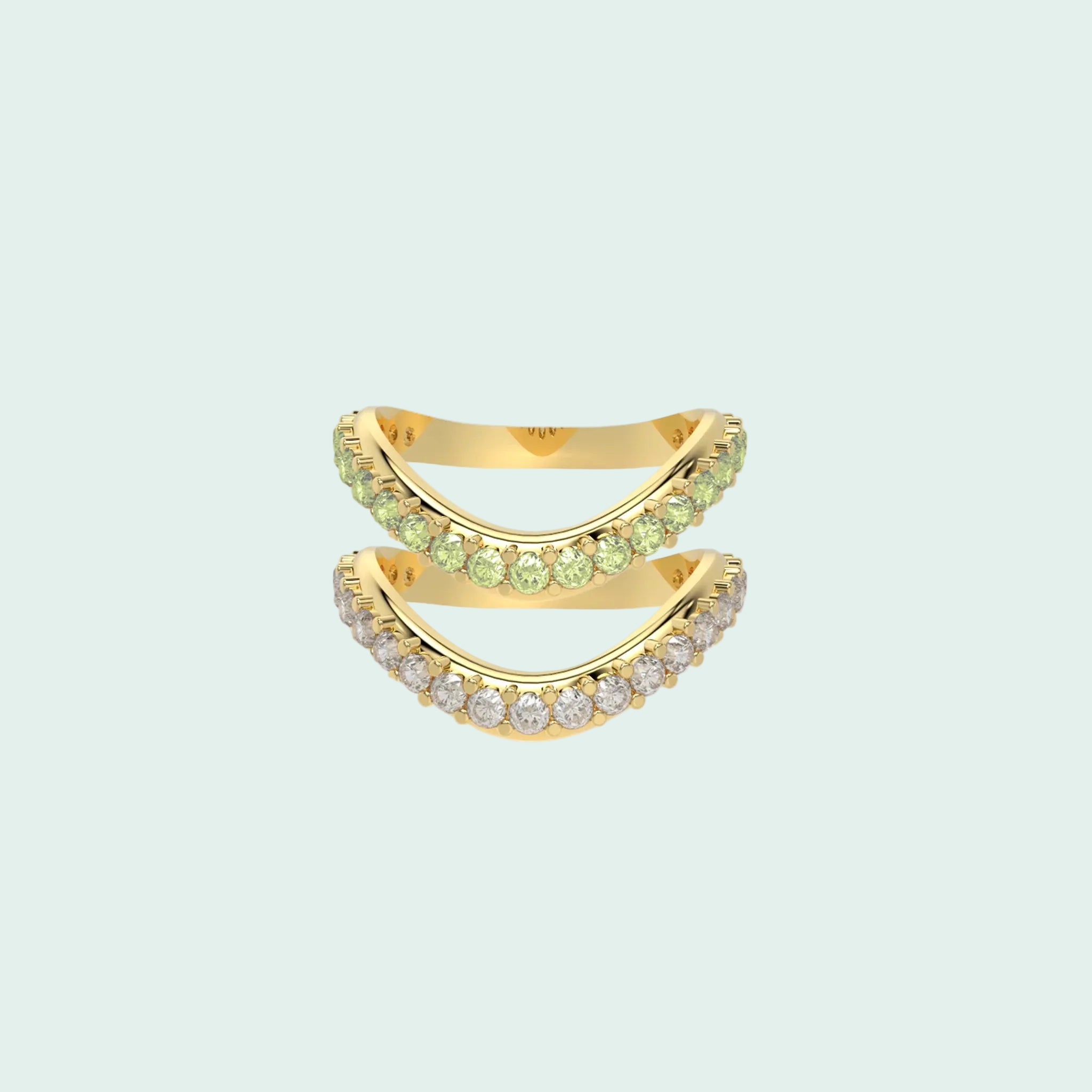 Gold ring with green gemstones on a white background