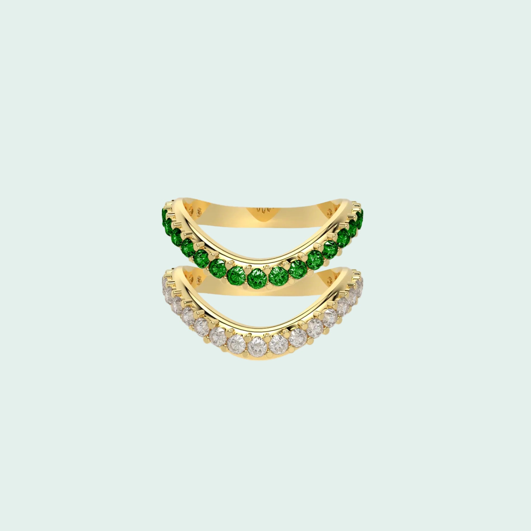 Gold ring with green gemstones on a white background
