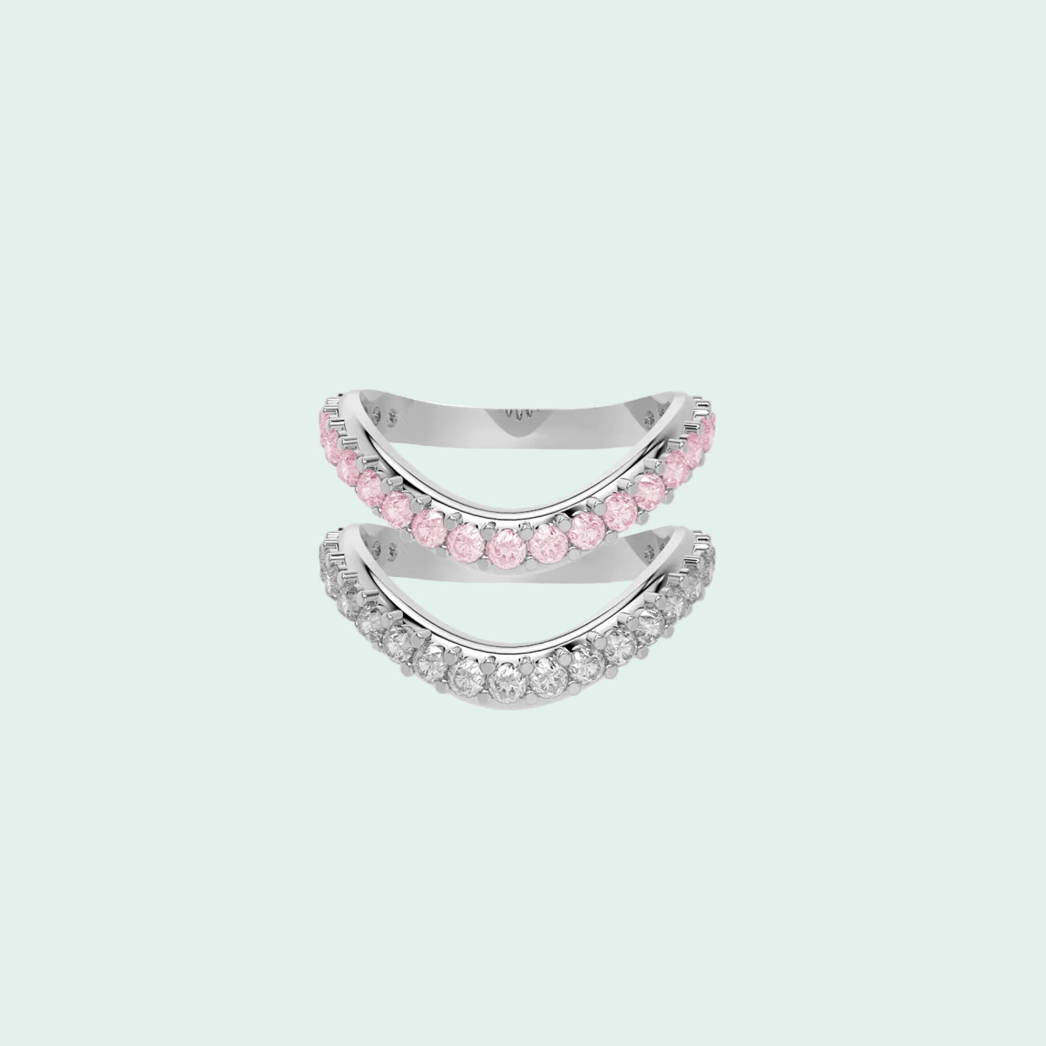 Two silver rings with pink gemstones on a white background