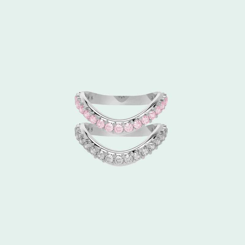 Two silver rings with pink gemstones on a white background