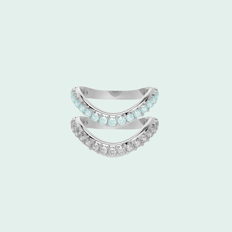 Two silver rings with gemstones on a white background