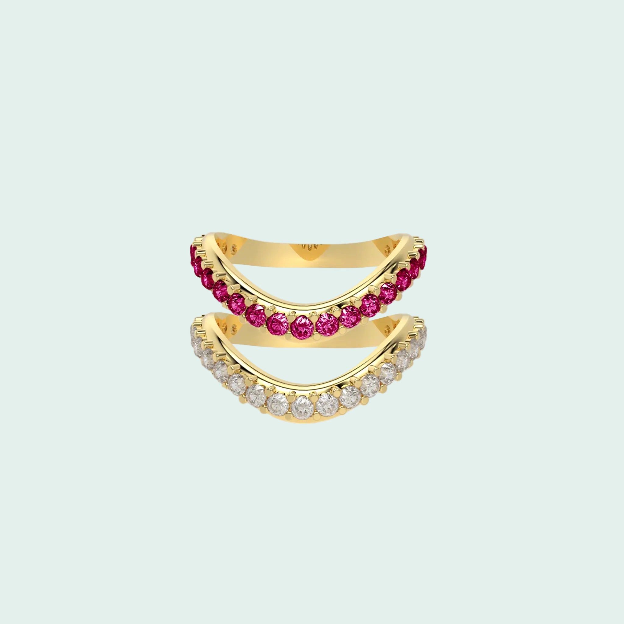 Gold ring with pink gemstones on a white background