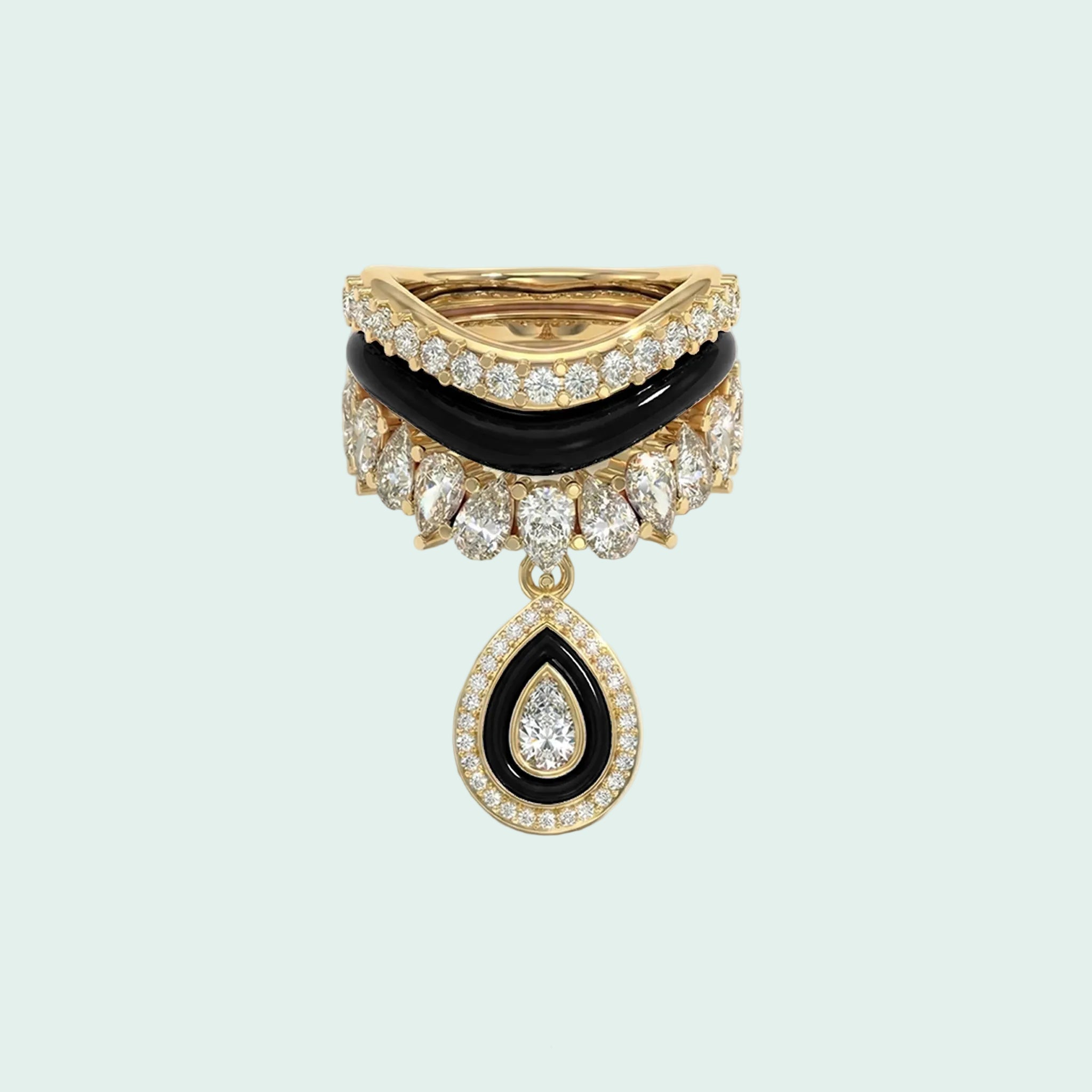 Stack of three gold and green rings with diamond accents on a white background
