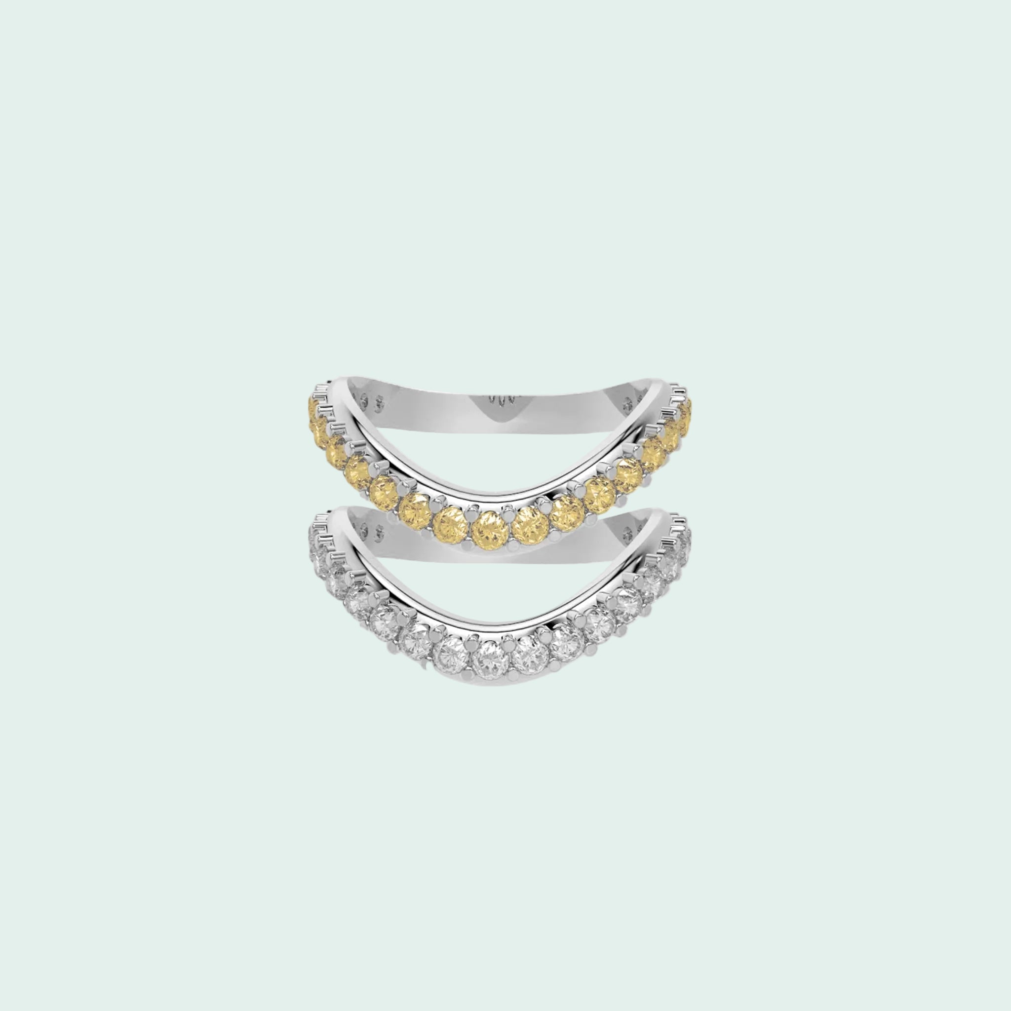 Two diamond rings, one with yellow gemstones and the other with white gemstones, on a white background.