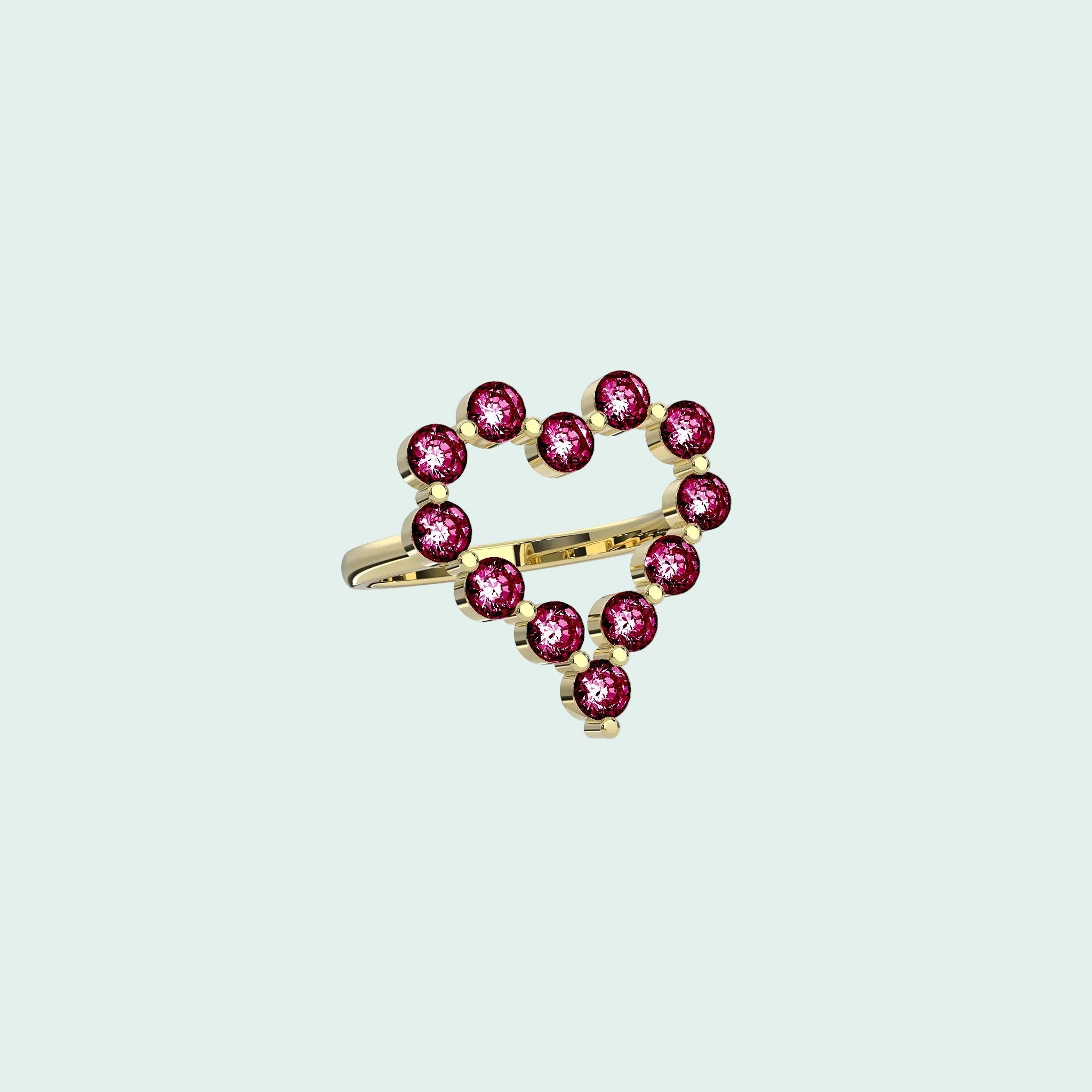 Gold ring with pink gemstones on a white background