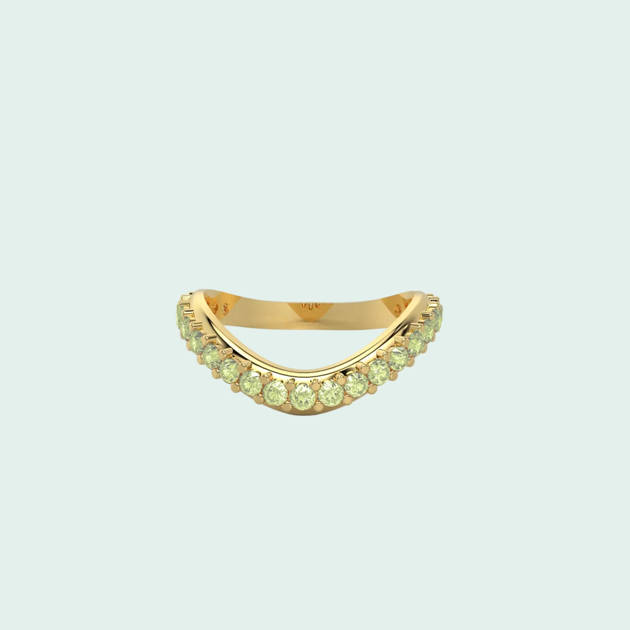 Gold ring with green gemstones on a white background